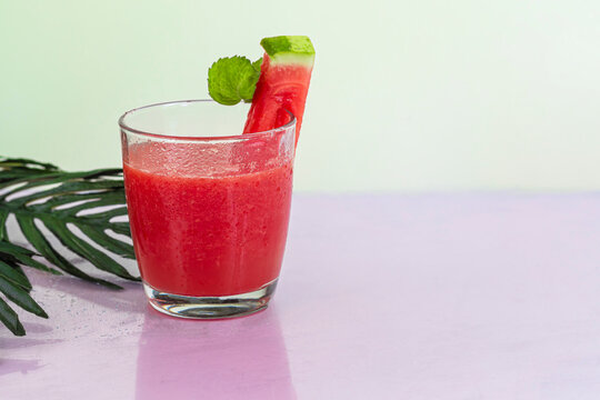 Watermelon pulp smoothie. Delicious red sliced watermelon on a plate. Stock of fiber and fructose. Summer food concept.