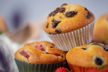Cupcakes with fruit and chocolate on a marble background