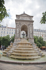 Fototapeta na wymiar Ancient fountain in Paris, France.