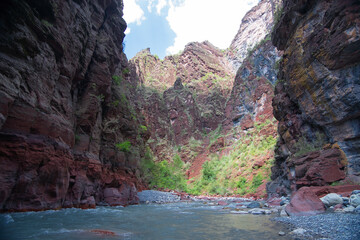 Var river and red stones at the bottom of Daluis Canyon or Daluis gorge. Daluis, France