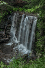 Naklejka na ściany i meble Waterfall on Divoky creek near Kouty nad Desnou village in summer day