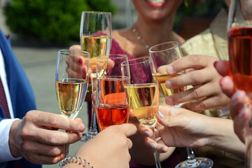 Celebration. People holding glasses of champagne making a toast