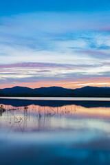 Blue Ridge mountains reflect in rain inspired Lake Wilson near Brevard
