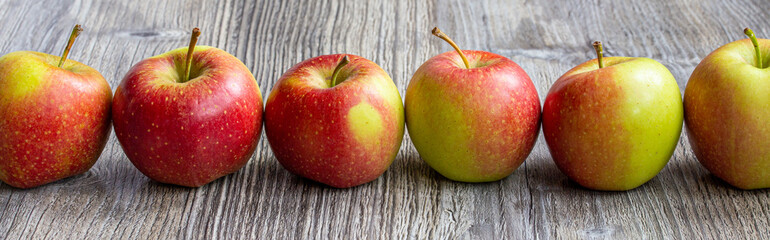 apples on wooden table with old planks