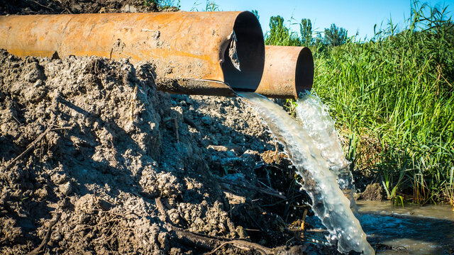 Ecology, environmental pollution,wastewater discharge in the forest,into nature,industrial pollution.Dirt is discharged through pipes.