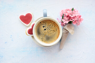 cup of aromatic coffee, heart cookies and a bouquet of flowers on white, Romantic date, invitation, sweet wish card text space concept