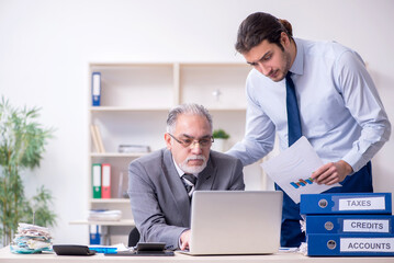 Two accountants working in the office