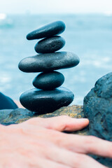 Balancing stones arranged in a pyramid shape