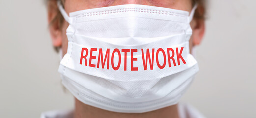 Remote Work theme with person wearing a protective surgical face mask