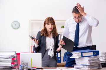 Two employees working in the office
