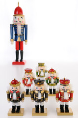 Fototapeta na wymiar Nutcracker soldier figurines with Captain on white background