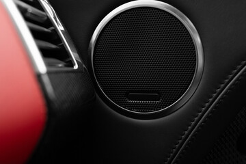 Round speaker at the panel of modern car