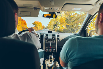 phone with navigation at car dashboard autumn speedway