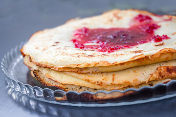 pancakes with raspberry jam. close up.