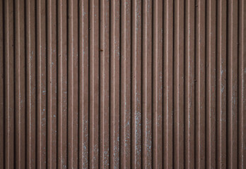 Metallic striped corrugated brown background. Texture.