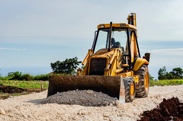Front-end Loader Spreading Marl On Roadway