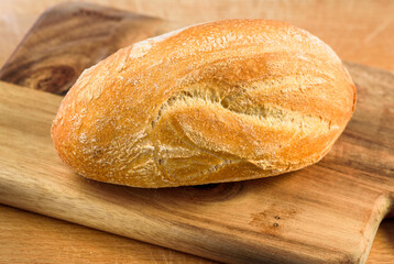 Homemade white bread on wooden cutter.