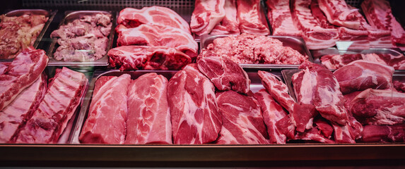 Quality raw meat showcase. Fresh and pink meat collection. Meat shop. Various and good product in...