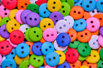 Various sewing Colorful plastic buttons as background