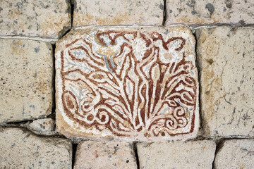 Decorative, floral ornament on the wall. Background, pattern