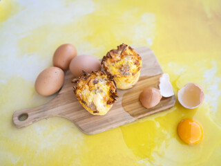 Organic baked egg bites on yellow background