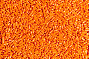Orange sprinkles macro background, halloween theme