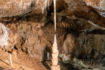 Long thin limestone stalactite and opposite stalagmite in Punkva Caves, Moravian Karst, Czech Republic