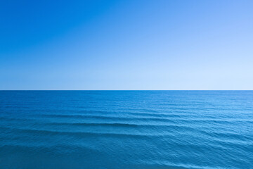 Beautiful sea with waves under blue sky