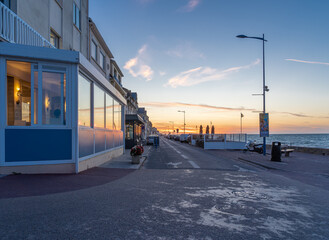 Obraz premium Langrune Sur Mer, France - 08 03 2020: View from the pier at sunset