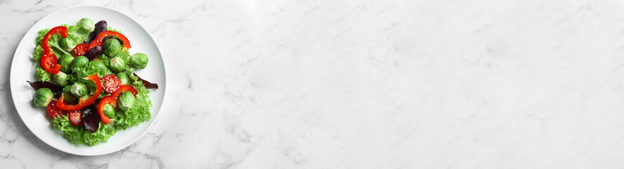 Tasty salad with Brussels sprouts and space for text on white marble table, top view. Banner design