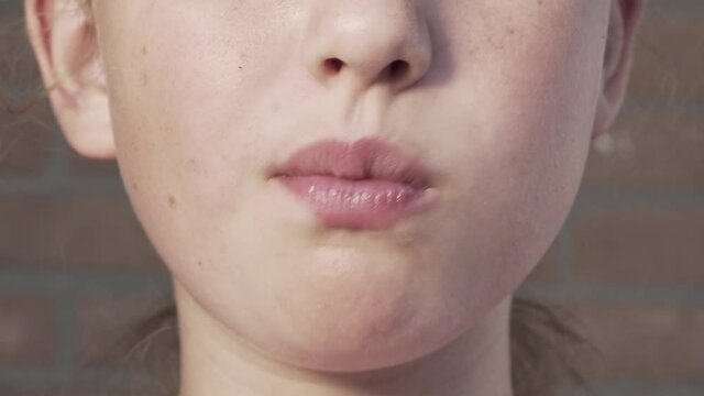 Selective focus. Girl eating ice cream. Caucasian girl with chocolate delicacy. Close up