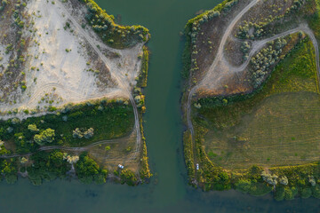 Shoreline with green reeds and sand. Aerial view.