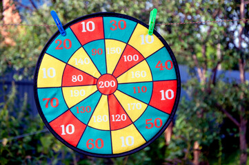 Textile colorful dart for safety and child playing. Children s gamehanging on clothespins. Close up.