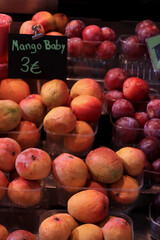 Fresh baby mangoes at a market
