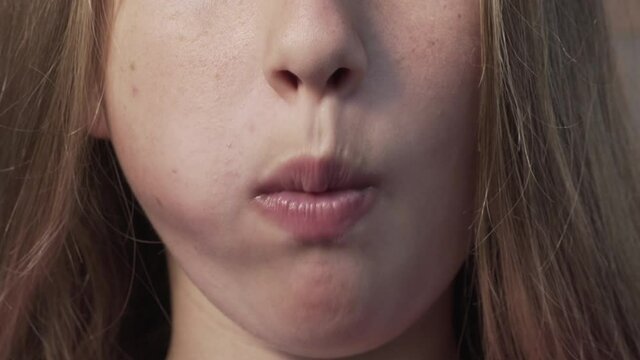 Selective focus. Girl eats chicken nuggets harmful and tasty fast food. Close up 