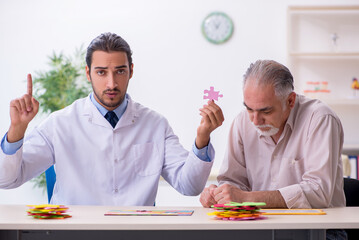 Doctor and patient suffering from Alzheimer disease