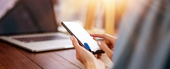 Obraz premium Woman pointing on smartphone screen, chatting in social networks, meeting website, searching internet, sending sms, using text messenger or online banking
