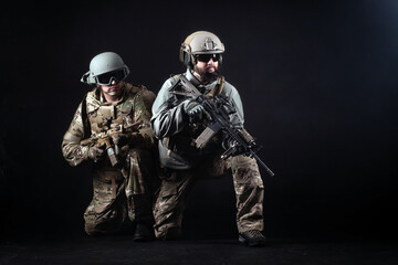 American special forces, two soldiers in military uniform with weapons attack, elite troops on...