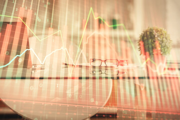 Double exposure of financial graph drawing and office interior background. Concept of stock market.