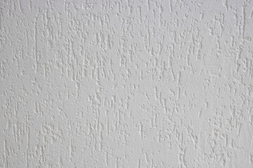 White with decorative relief . White stucco wall. The white background of the walls