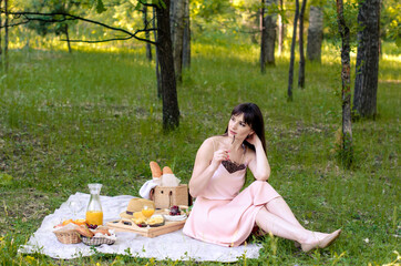 Smiling woman having a relaxing lunch break outdoors