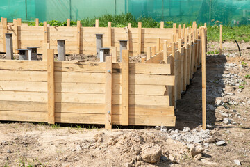 Wooden timbering (casing) for new house foundation