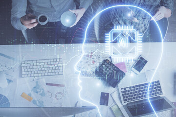 Double exposure of man and woman working together and human brain hologram drawing. Brainstorm concept. Computer background. Top View.