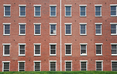 facade view of brick wall and window of old factory building