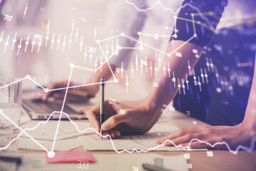 Multi exposure of woman hands typing on computer and financial chart hologram drawing. Stock market analysis concept.