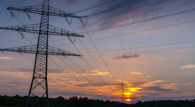 Power Line Timelapse with beautiful Sundown Pan Right