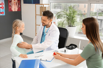 Fototapeta premium Mother with daughter visiting endocrinologist in clinic