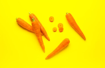 Fresh carrots on color background