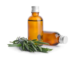 Bottles of rosemary essential oil on white background