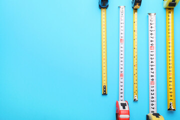 Measuring tapes on color background
